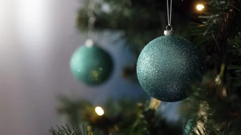 Turquoise shining with gold pattern ball hanging on the branch of Christmas tree Stock Footage 227205969