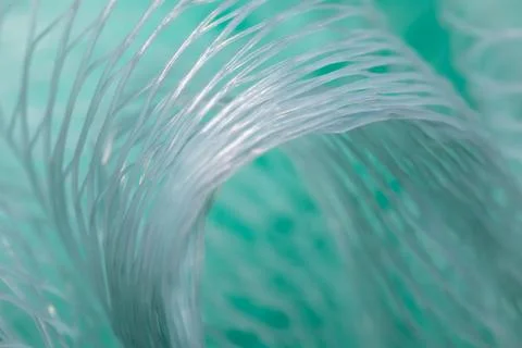 Turquoise shower puff texture background macro mesh bath sponge close up Stockfoto's