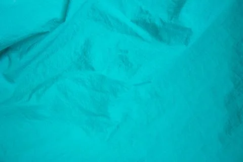 Turquoise silk texture background. Blue satin background close up Stock Photos
