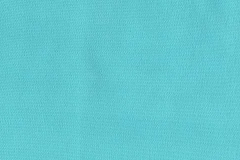 Turquoise soft fabric. The texture of the plain fabric for the dress Stock Photos