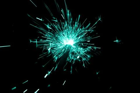 Turquoise sparkler countdown on fire with spread glitter sparks. Luxury enter Stock Photos