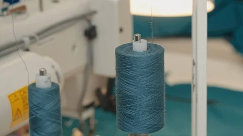 Turquoise spool of thread spinning Video stock 118118783