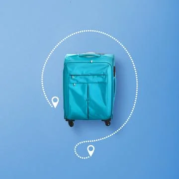 Turquoise suitcase on a blue background with a white dotted travel path and.. Stock Photos