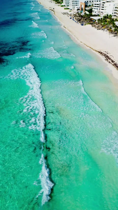 Turquoise surf and white sand beach seen from a drone 스톡 동영상 342090311
