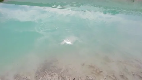Turquoise water and white kaolin clay in abandoned quarry Stock Footage 344812236