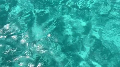 Turquoise water texture on a beach with crystal clear water and white sand Stock Footage 203799682