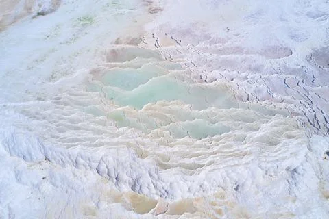 Turquoise water of thermal source in the white natural pools. Pamukkale Stock Photos