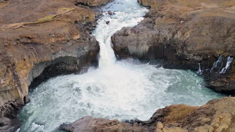 Turquoise waterfall Aldeyjarfoss dropping through a rugged canyon. Iceland Stock Footage 345168037
