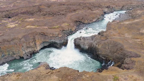 Turquoise waterfall Aldeyjarfoss dropping through a rugged canyon. Iceland Stock Footage 345168828