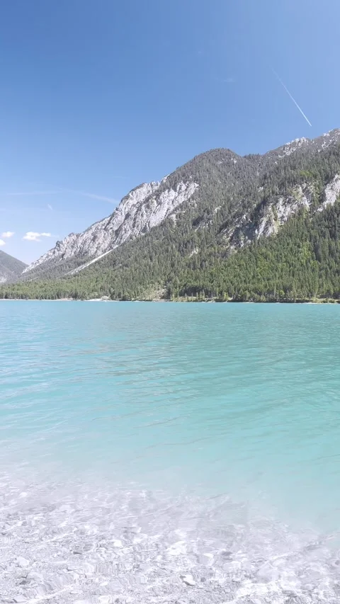 Turquoise Waters and Mountain Reflections at Plansee Lake in Austria  Peacefu Stock Footage 308305037
