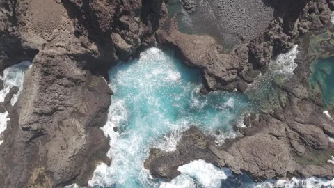 Turquoise waters cascading through rugged volcanic rocks along La Palma 스톡 동영상 308398903