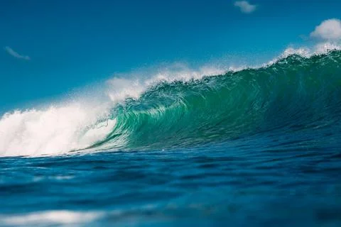 Turquoise wave in ocean. Breaking wave in sunny day Stock Photos