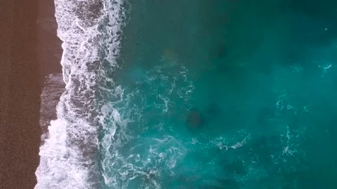 Turquoise waves on the beach view from a quadrocopter Stock Footage 131456991