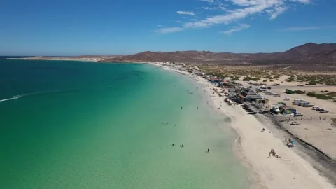 Turquoise waves gently lapping at la paz beach's white sands Vídeos de archivo 305164314
