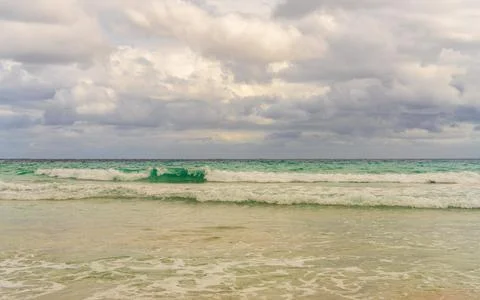 Turquoise waves gently rolling onto sandy beach in Mallorca. Beautiful nature Stock Photos