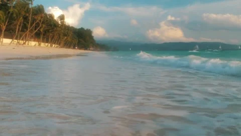 Turquoise Waves Gently Rolling on a Tropical Sandy Beach Stock Footage 303217015