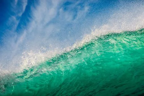 Turquoise waves in ocean. Breaking wave with sun light Stock Photos