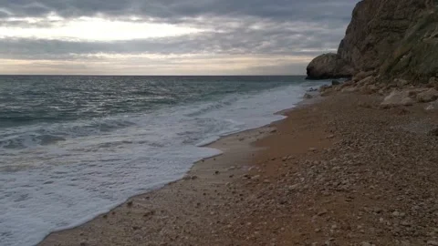 Turquoise waves roll over the beach Stock Footage 147734598