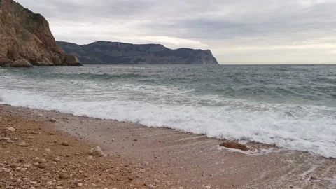 Turquoise waves roll over the beach Stock Footage 147734795