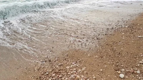 Turquoise waves roll over the beach. Stock Footage 147734810