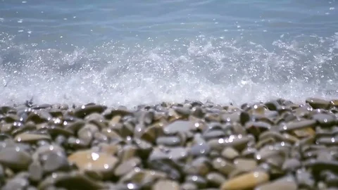 Turquoise waves run to the shore, covered with pebbles and broken. 4k, 3840x2160 Stock Footage 83343455