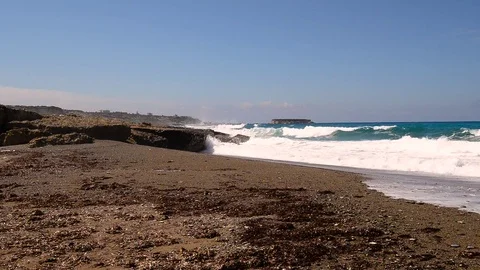 Turquoise waves splash on the sandy beach of the peninsula Akamas, Cyprus Stock Footage 83501959