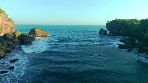 Turquoise waves surge through rugged coastal rocks along the dramatic Ngere.. Stock Footage 341544518