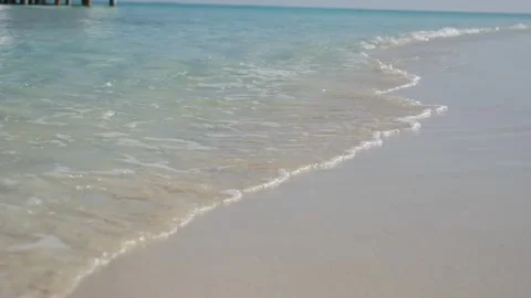Turquoise waves on white sand beach Stock Footage 329965389