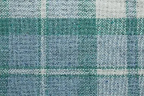 Turquoise woolen fabric with geometrical pattern as background, top view Stock Photos