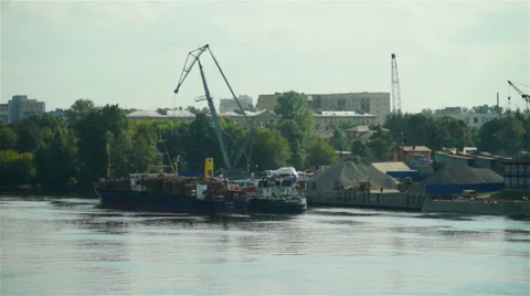 Turret slewing crane  working at Neva river port Stock Footage 35754798