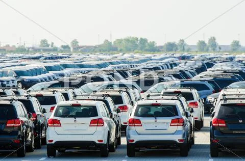 TUSCANY, ITALY - 27 June: New cars parked at distribution center Stock Photos