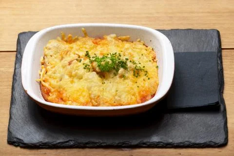 Tuscany potatoes dish on a wooden table Stock Photos