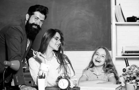 Tutor for excellence. Extra classes. Gifted child. Little girl studying with Stock Photos