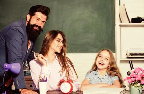 Tutor for excellence. Extra classes. Gifted child. Little girl studying with Stock Photos