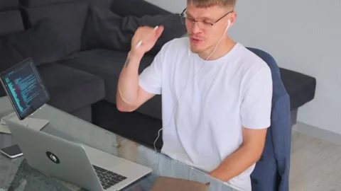 Tutor explains material on video call, encouraging student success. Stock Footage 294299393