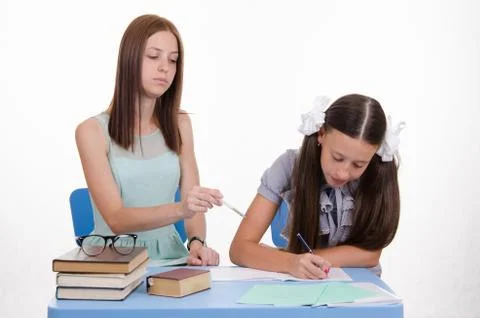 Tutor girl shows development of the solution Foto stock