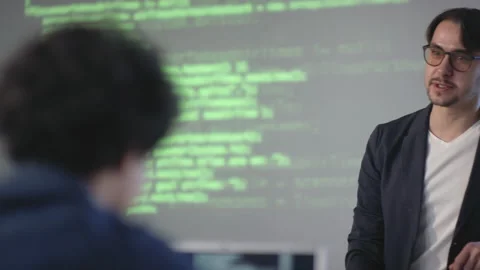 Tutor Giving IT Lesson To Young Programmers Stock Footage 141981694