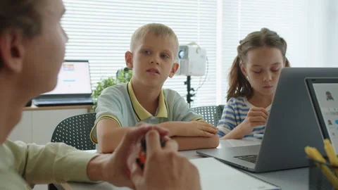 Tutor Talking to Kids at Programming Class Stock Footage 280541298