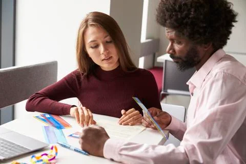 Tutor Using Learning Aids To Help Student With Dyslexia Stock Photos