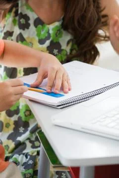 Tutor working with elementary school student Fotos Stock
