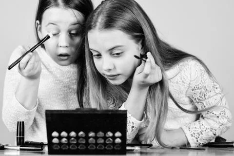 Tutorial for beginners. Little girls doing face painting and makeup tutorial Stock Photos