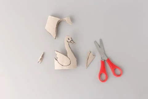 Tutorial how to cut out paper swan bird toy, recycle art, toilet paper roll.. Stock Photos
