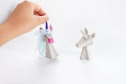 Tutorial on how to make unicorn from recycled paper. Kids craft, creative and Stock Photos