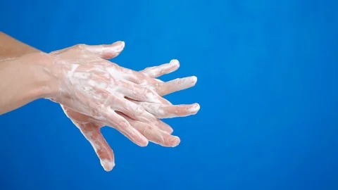 Tutorial, how to wash your hands with soap. closeup on blue background. Stock Footage 126750547