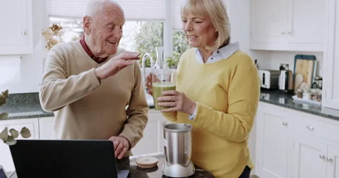 Tutorial, laptop and senior couple with a smoothie and watching online video and 動画素材 307961838