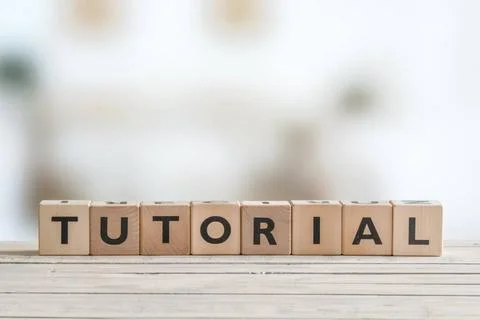  Tutorial sign made of cubes Tutorial sign made of cubes on a wooden table... Fotos Stock