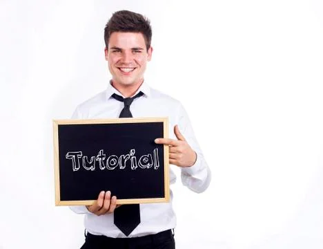 Tutorial - Young businessman holding chalkboard with text Foto stock