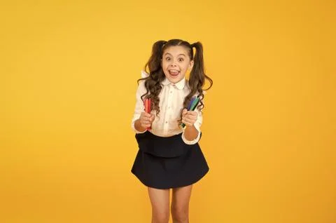 Tutorials for little hands. Crafts for elementary school kids. Schoolgirl hold Stock Photos