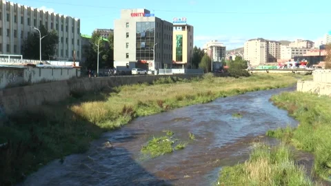 The Tuul River flowing through the city of Ulaanbaatar, Mongolia. Stock Footage 303728584