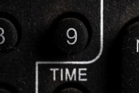Tv 9 icon and button close up of a old dusty black Television remote controll Stock Photos